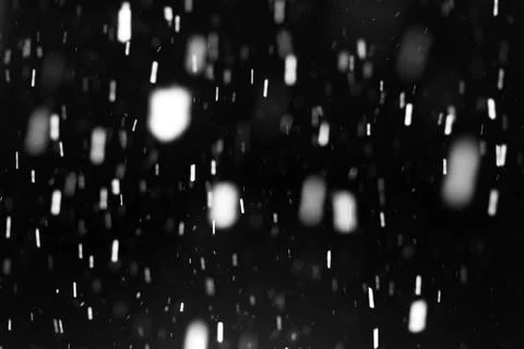 Snowfall on black background Stock Photos