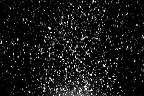 Snowfall on black background Stock Photos