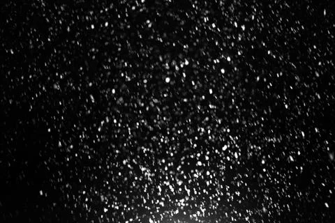 Snowfall on black background Stock Photos