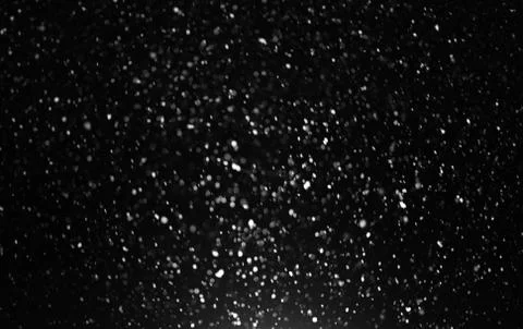 Snowfall on black background Stock Photos