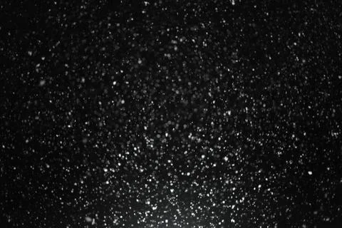 Snowfall on black background Stock Photos