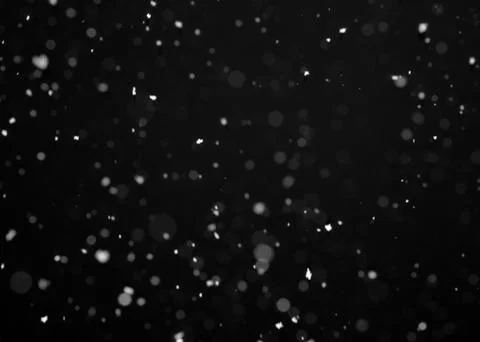 Snowfall on black background Stock Photos