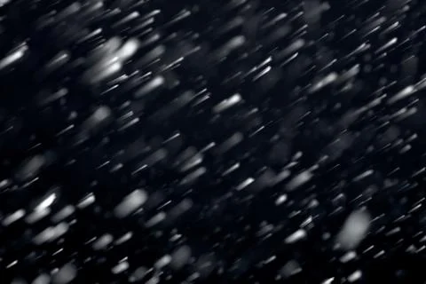 Snowfall on black background Stock Photos