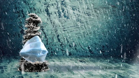 Snowfall on christmas tree in mask Stock Footage 142892762