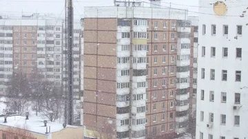 Snowfall in the city area. Stock Footage 85707780