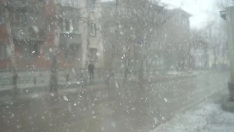 Snowfall in the city. falling snowflakes close-up Video stock 88638970