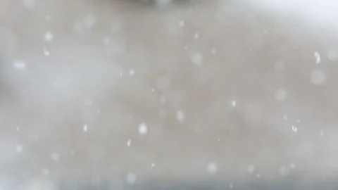 Snowfall in a city. Simple scene - falling snowflakes on a cityscape background. Stock Footage 127894401