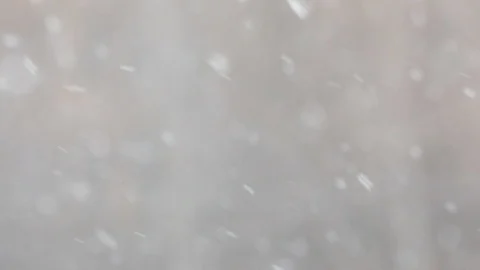 Snowfall in a city. Simple scene - falling snowflakes on a cityscape background. Stock Footage 127894409