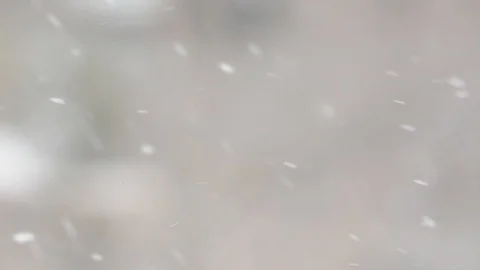 Snowfall in a city. Simple scene - falling snowflakes on a cityscape background. Stock Footage 127894438