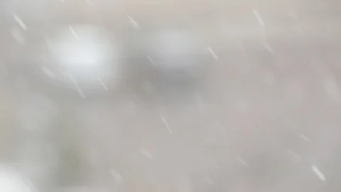 Snowfall in a city. Simple scene - falling snowflakes on a cityscape background. Stock Footage 127894442