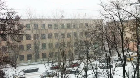 Snowfall on city street, high angle view Stock Footage 5090159