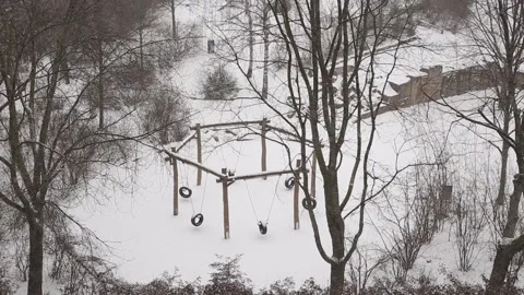 Snowfall Covers Children's Recreation Area During Cold Front In Germany Stock Footage 148420053