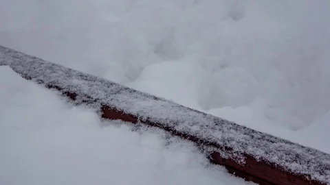 Snowfall covers the railing of the stairs Stock Footage 103987190