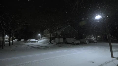 Snowfall on a dark evening, night in a suburban neighborhood in winter, snow Stock Footage 301785302
