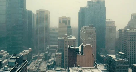 Snowfall in Downtown Cityscape Viewed from Office Window Stock Footage 323681630