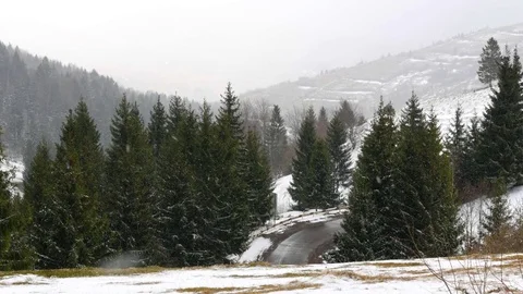 Snowfall early spring in the mountains. Stock Footage 74749672