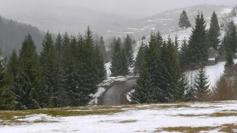 Snowfall early spring in the mountains. Stock Footage 74848441