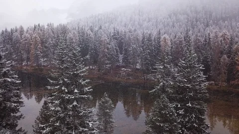 Snowfall, first snow in Dolomites mountains, aerial view Stock Footage 119916660