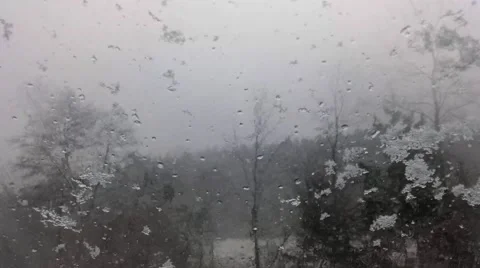 Snowfall in the forest and window glass Stock Footage 46701366