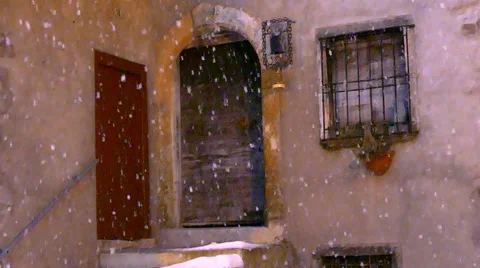 Snowfall in front of an old house, slow motion. Stock-Footage 47568506