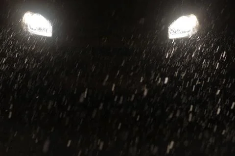 Snowfall head lights Stock Photos