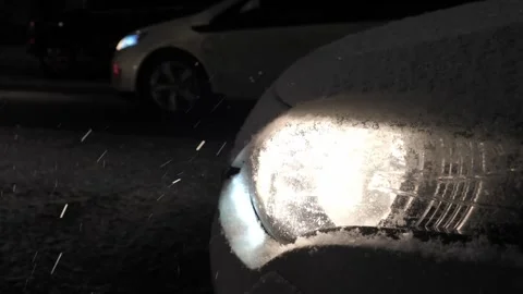 Snowfall in the light of car headlights.  Stock Footage 261155193