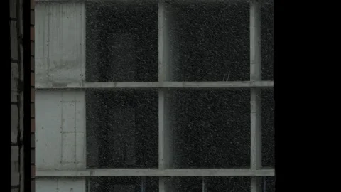 Snowfall on monolithic concrete building facade Stock Footage 327064324