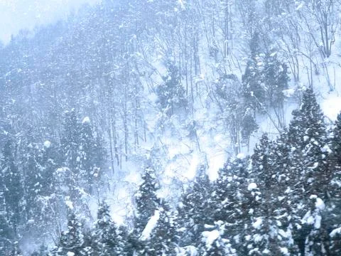 Snowfall in mountains Stock Photos