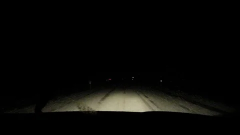 Snowfall on the night road. Stock Footage 122261212