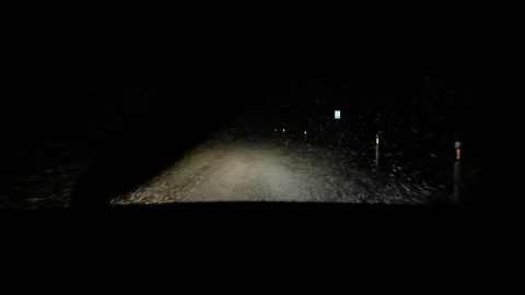 Snowfall on the night road. Stock Footage 122261337