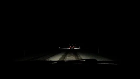 Snowfall on the night road. Stock Footage 122261399