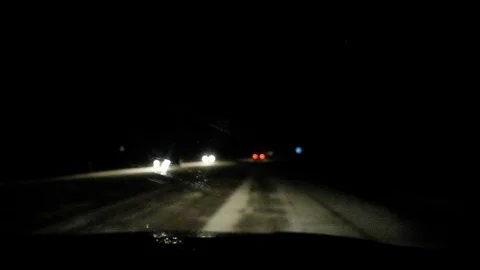Snowfall on the night road. Stock Footage 122261441