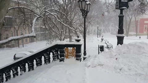 Snowfall in old part of city Stock Footage 143652872