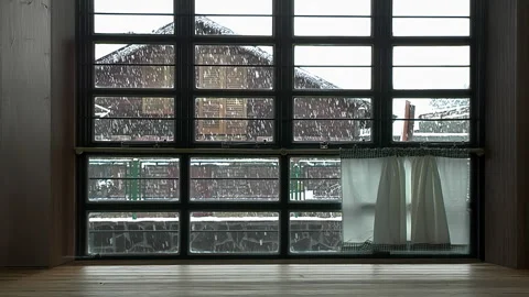 Snowfall Outside Rustic Window in Winter Stock Footage 331667070