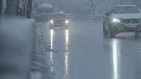 Snowfall over a boulevard with cars in Sofia Stock-Footage 328318487