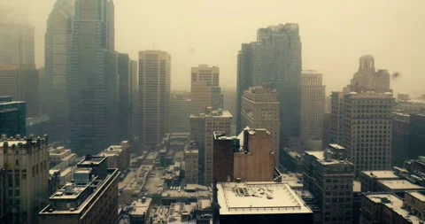Snowfall Over Downtown Buildings Viewed from Office Window Stock Footage 323681585