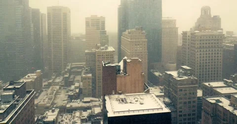 Snowfall Over Downtown Cityscape Viewed from Office Window 스톡 동영상 323681298
