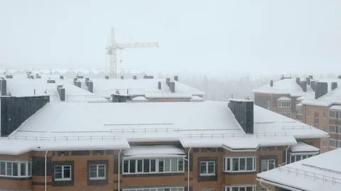 Snowfall over high rise building Stock Footage 80815100