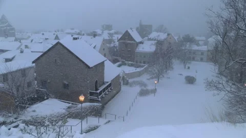 Snowfall over historic old town in winter, Visby, Gotland Stock Footage 328587583
