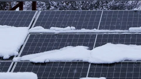 Snowfall over photovoltaic panel Stock Footage 296343563
