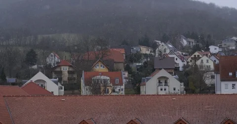 Snowfall Over the Sloping Roofs, 4K Stock Footage 84976916