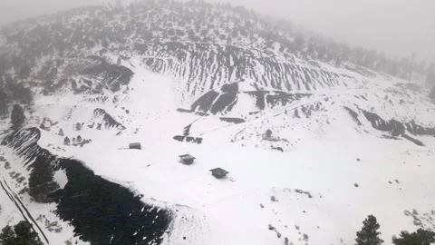 Snowfall Over Volcanic Cinder Hills – Aerial Drone Shot of Winter Landscape Video stock 304090071