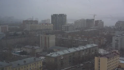 Snowfall on an overcast day against the backdrop of the city 스톡 동영상 88638194