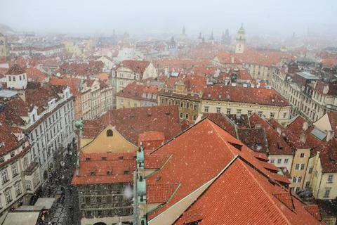 Snowfall in Prague. View of the red roofs and the historic city center. Winter Stock Photos