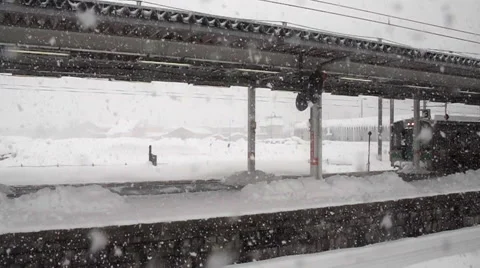 Snowfall at railway station Stock Footage 53206459
