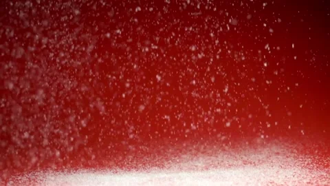 Snowfall on red background Stock Footage 227309046