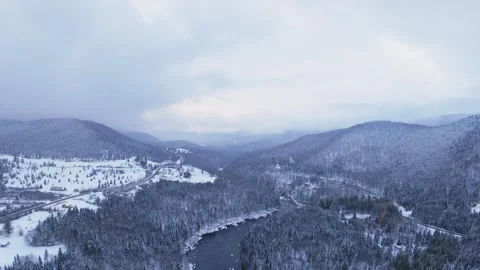 Snowfall river mountain valley Stock Footage 321102173