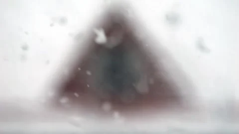 Snowfall in slow motion against the backdrop of houses. Beautiful snowflakes Video stock 306158129