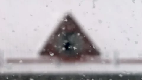 Snowfall in slow motion. Snow falls on the city. Snowstorm in winter Stock Footage 306318180