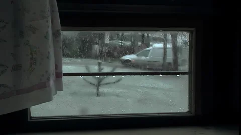 Snowfall on a Street Seen Through a Window Stock Footage 330491948